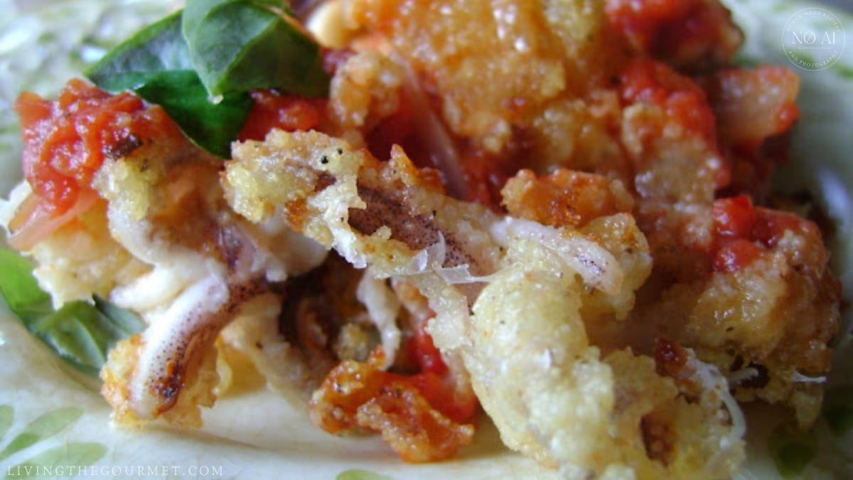 Plated Fried Calamari & Clams with Red Sauce with basil