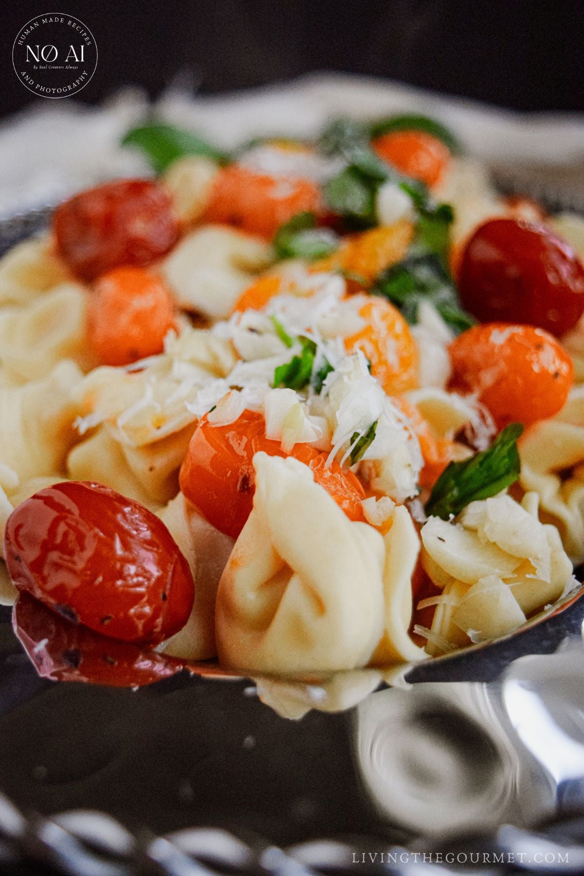 A close-up shot of Tortellini with Blistered Tomatoes