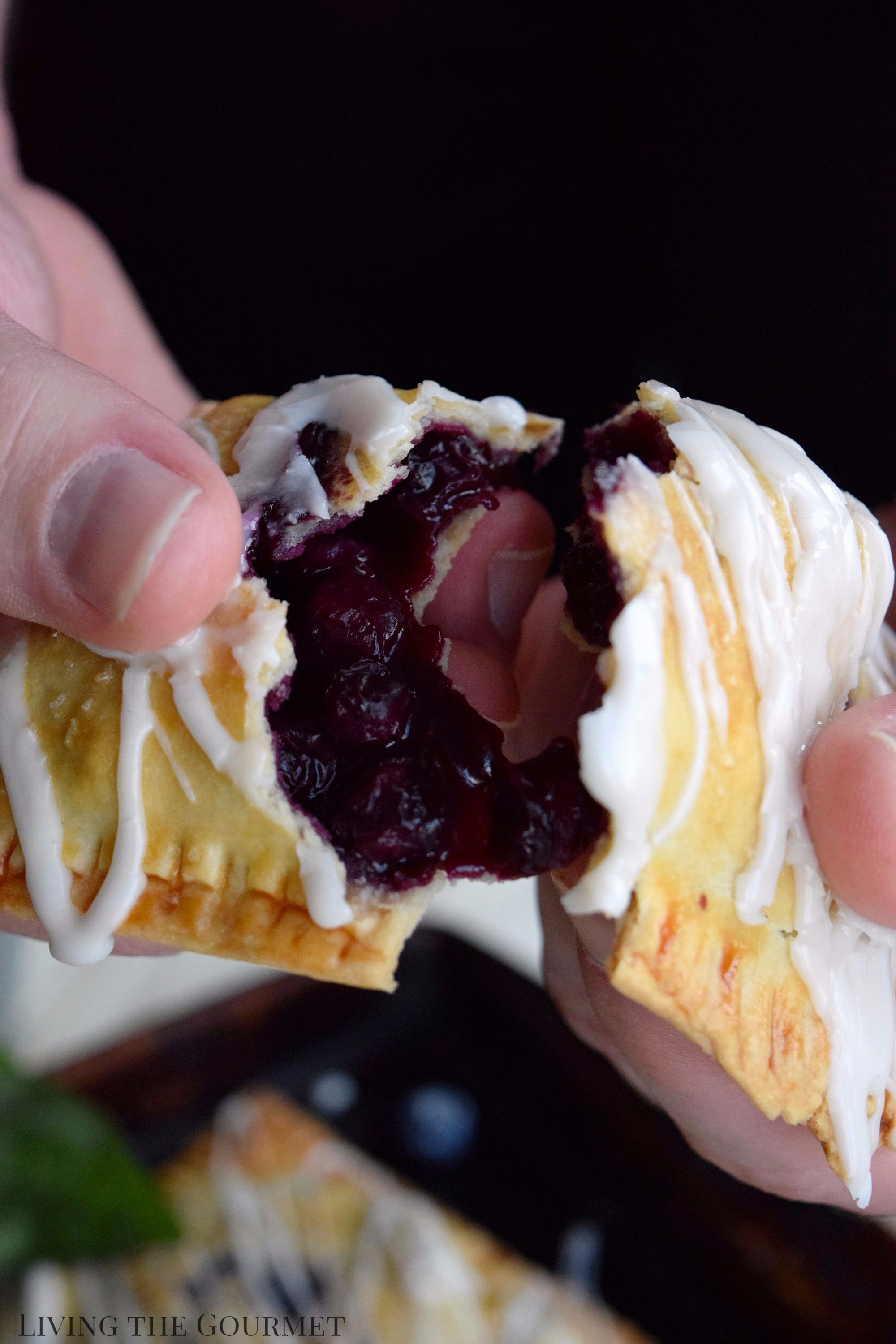 Living the Gourmet: Baked into a delicate, buttery crust, these Blueberry Basil Hand Pies are bursting with the flavors of the summer.