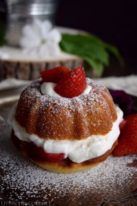 Living the Gourmet: Enjoy the final moments of summer with these Strawberries and Cream Naked Bundt Cakes. Fresh cream and sliced strawberries are layered between a moist, vanilla strawberry cake. #BundtBakers