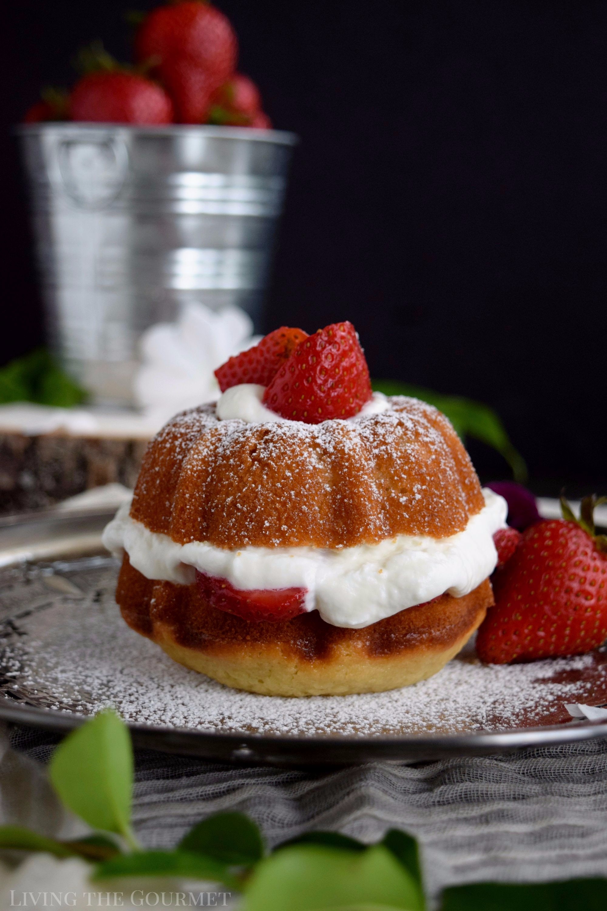 Living the Gourmet: Enjoy the final moments of summer with these Strawberries and Cream Naked Bundt Cakes. Fresh cream and sliced strawberries are layered between a moist, vanilla strawberry cake. #BundtBakers