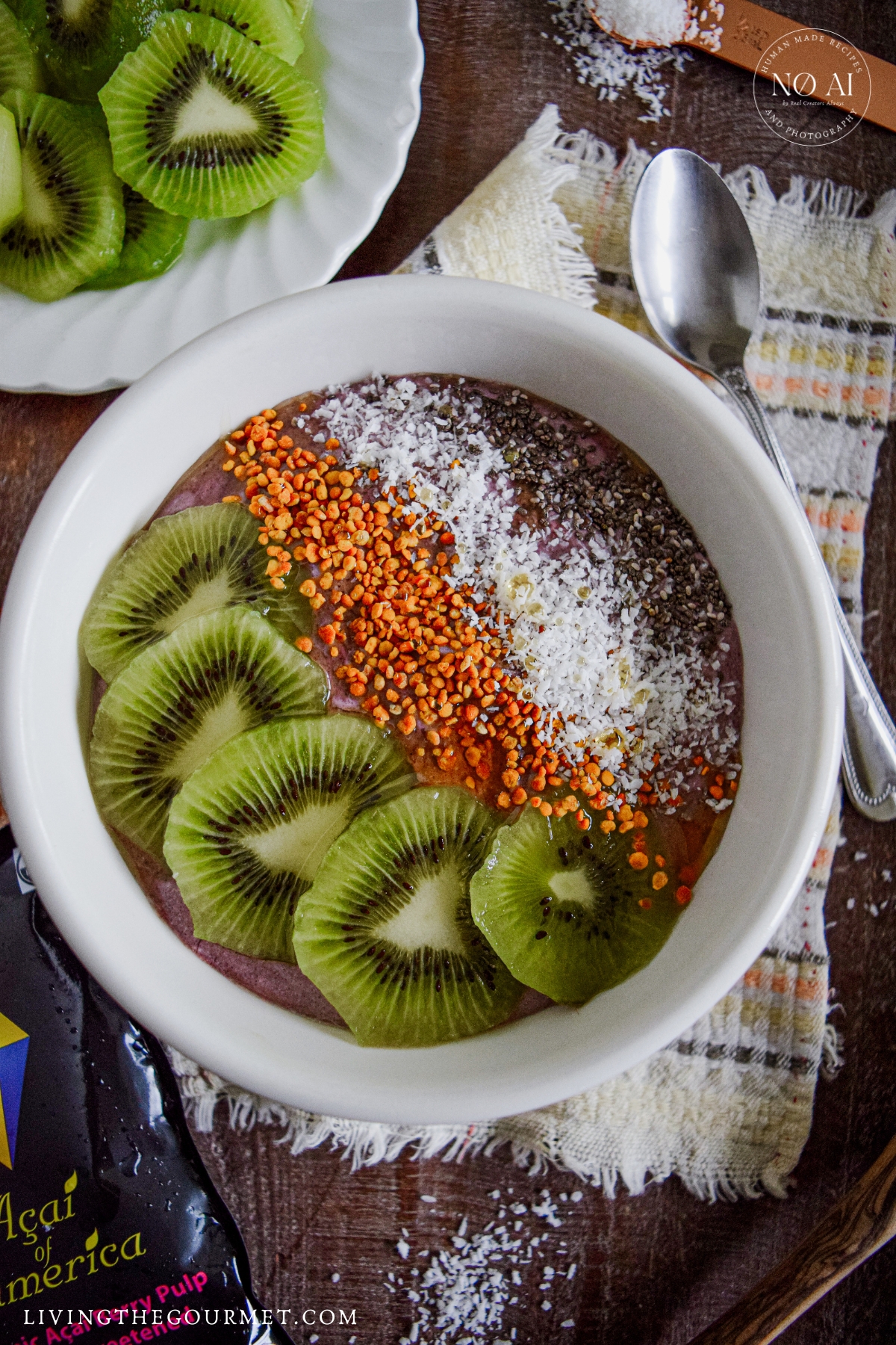 Acai Yogurt Bowl topped with fresh kiwis, bee pollen, raw honey, and coconut