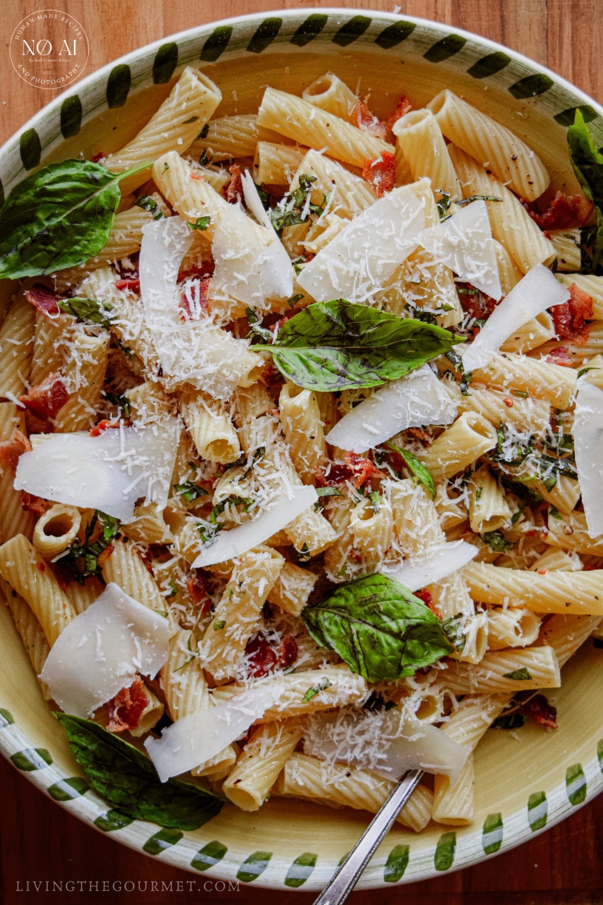 Pasta tossed with fresh basil, bacon, and grated cheese