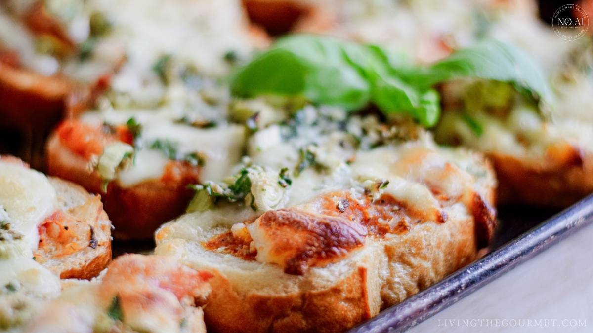 Mozzarella cheese melted to gooey decadence, a savory marinara sauce made with fresh tomatoes and caramelized onions, topped on crisped Italian bread, and then baked to golden perfection.
