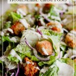 Today's Caesar Salad starts off with crisp Romaine lettuce leaves, thinly sliced red onions, and crunchy cucumbers, tossed with savory Parmesan cheese and golden croutons.