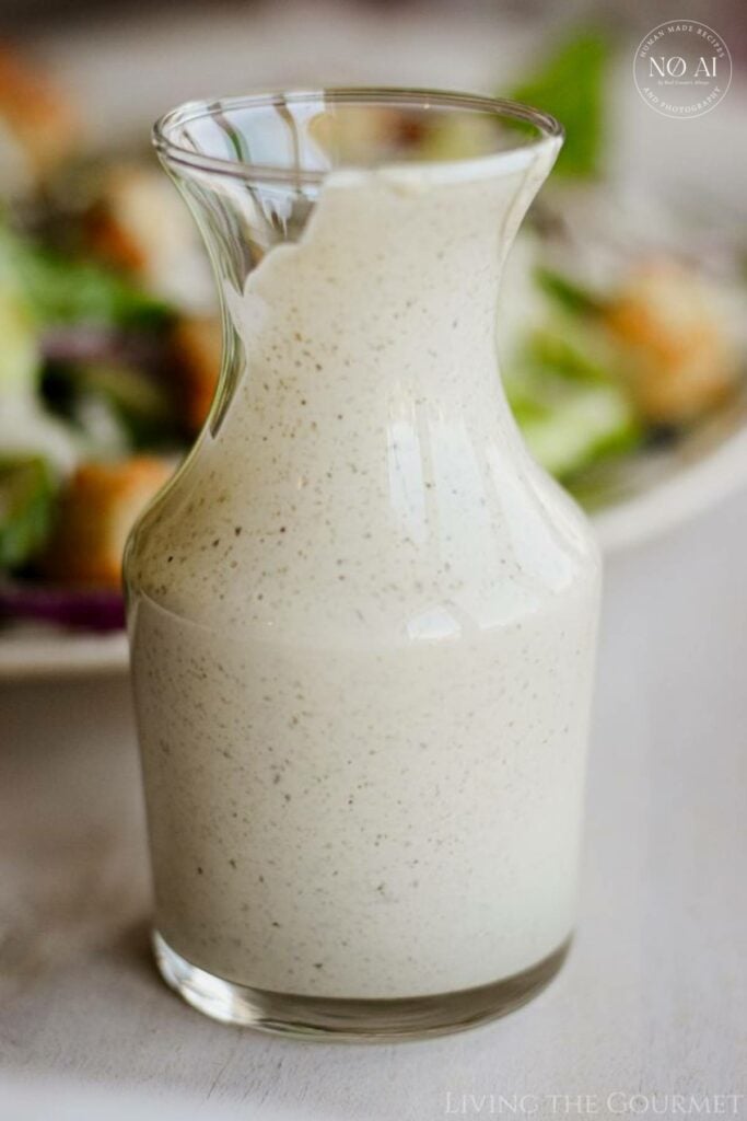 Our homemade Caesar Dressing, made eggless with a mix of olive oil and mayonnaise, along with capers, cheese, salt and pepper. The end result is a smooth and creamy dressing that's equal parts decadence and deliciousness.