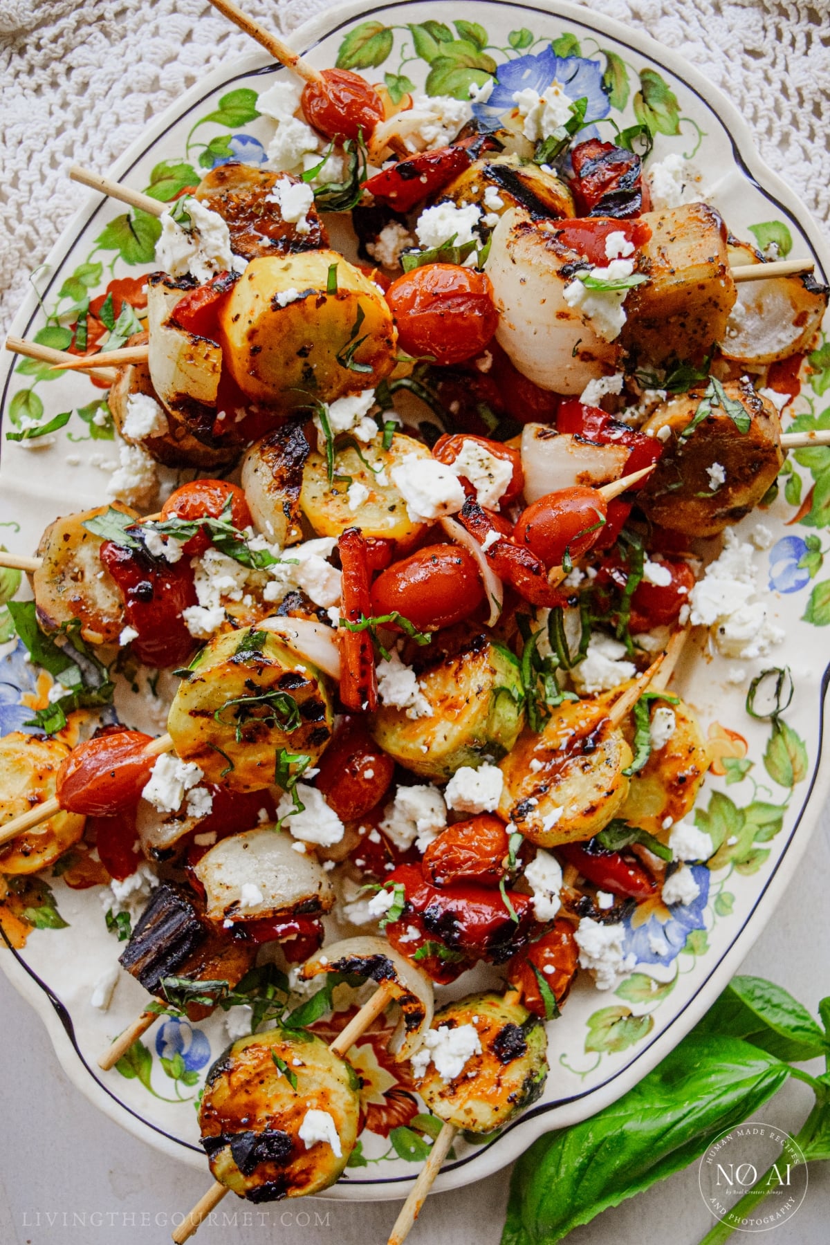 Griddle Vegetable Skewers Recipe with Marinated Feta plated for the summer dinner table.