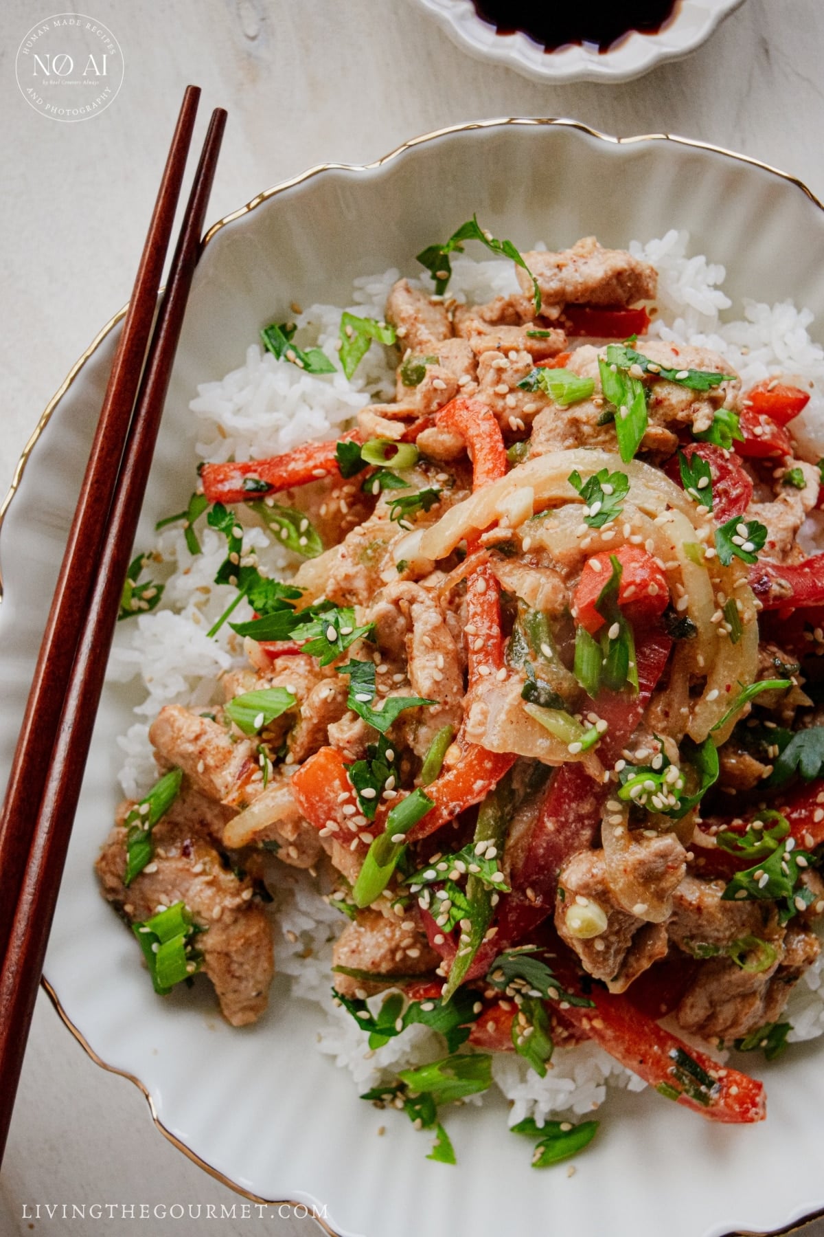 Tender pork tenderloin stir fry with colorful vegetables and sesame seeds