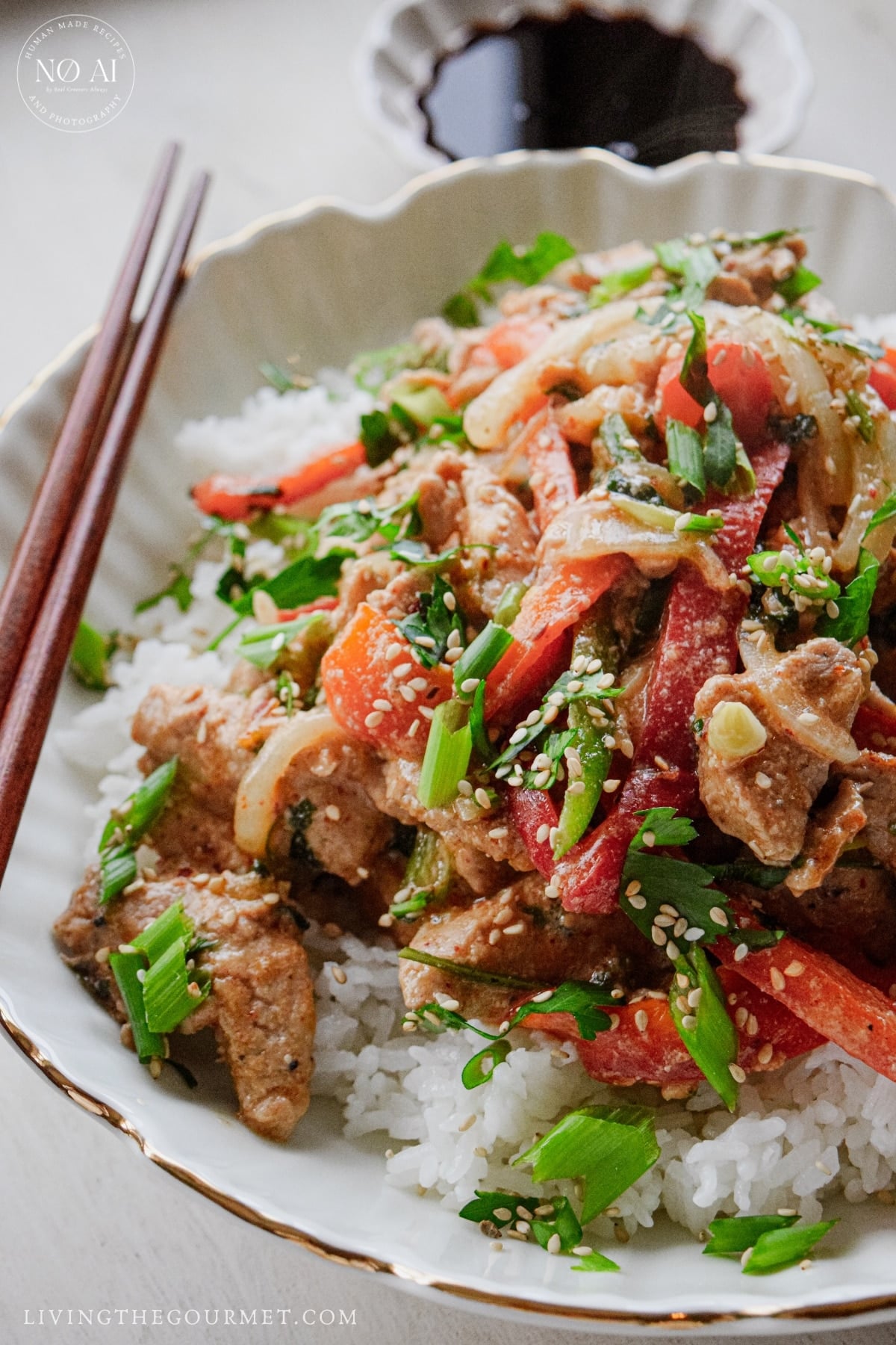Sliced bell peppers, onion, jalapeño, garlic, and scallions for pork stir fry