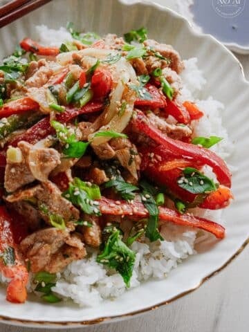 Pork and vegetable stir fry tossed in a savory soy and sesame sauce