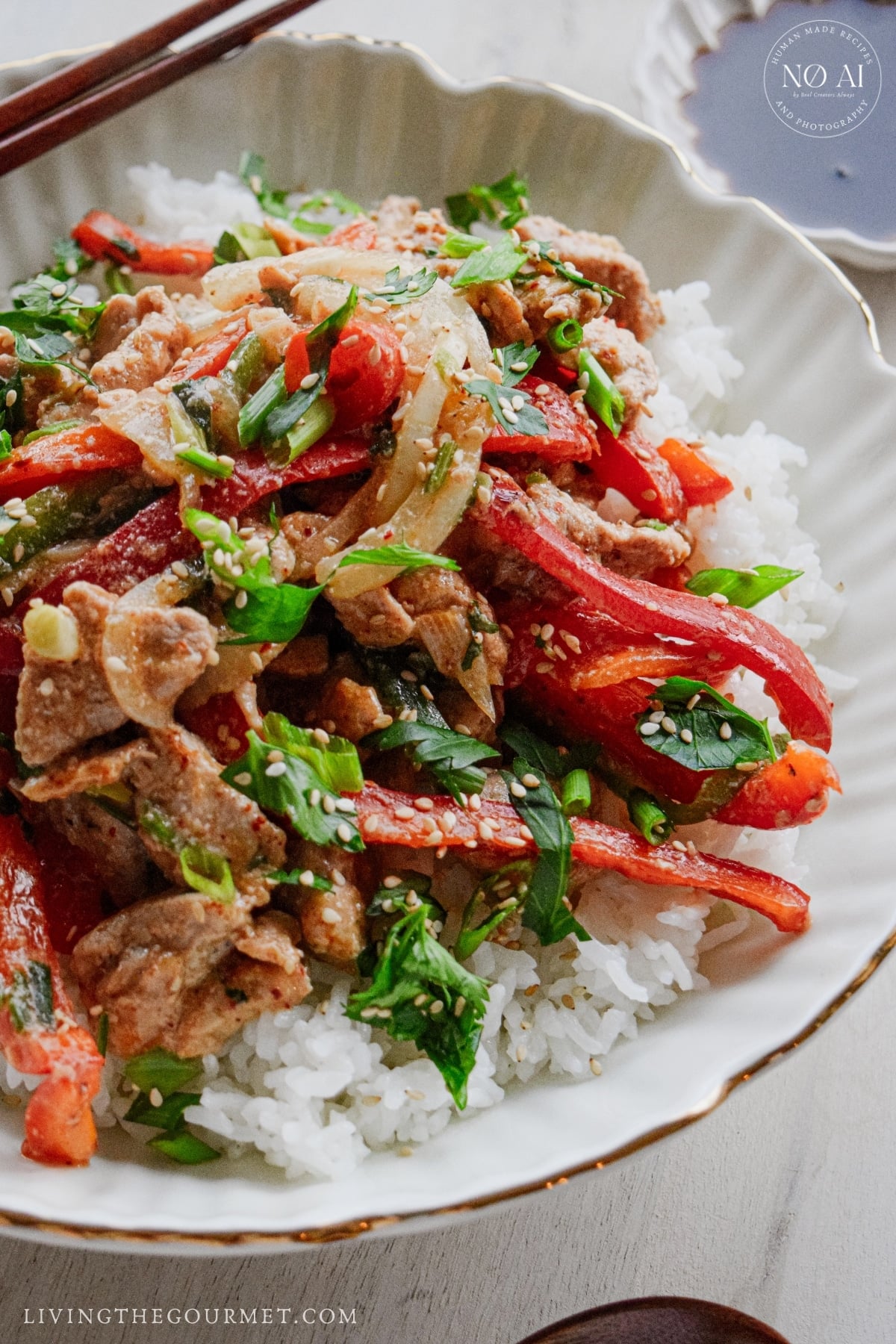 Pork and vegetable stir fry tossed in a savory soy and sesame sauce