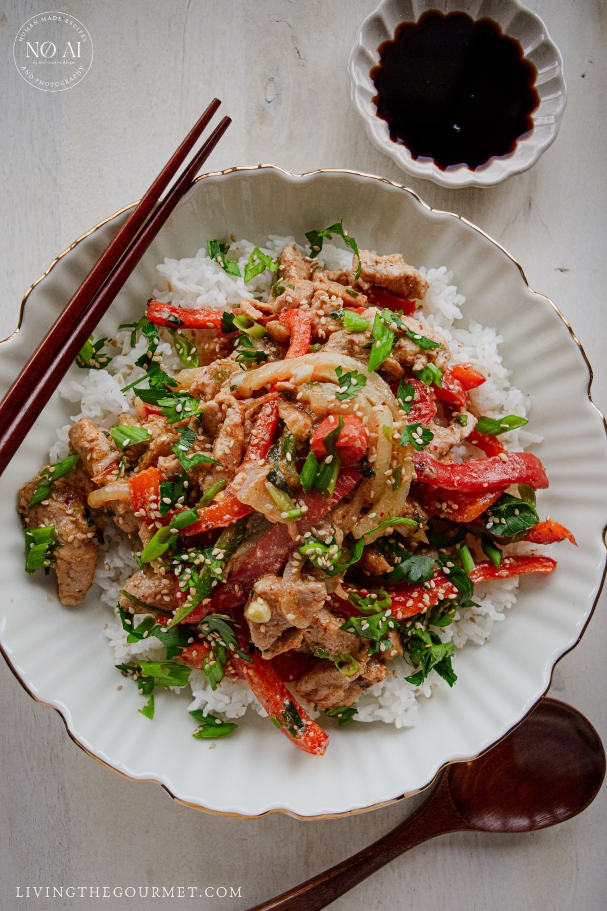 Easy takeout-style pork stir fry with tender pork, bell peppers, onions, and scallions in a savory umami sauce