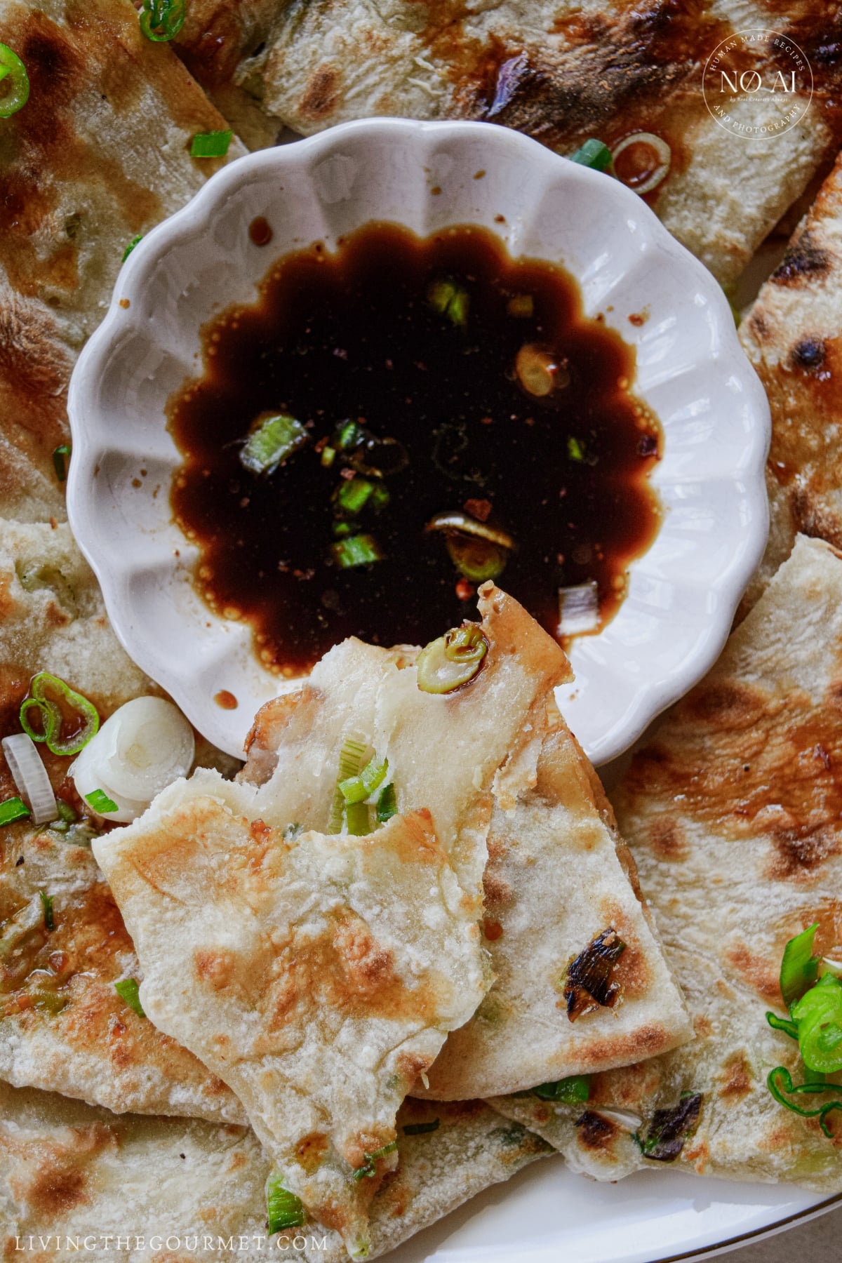 Soy sauce and chili crisp dipping sauce served with crispy scallion pancakes