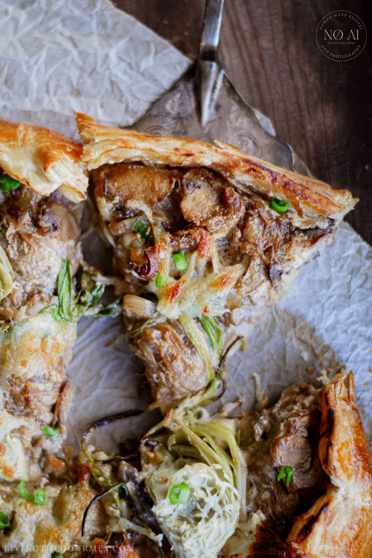 A slice of Caramelized Onion and Mushroom Galette
