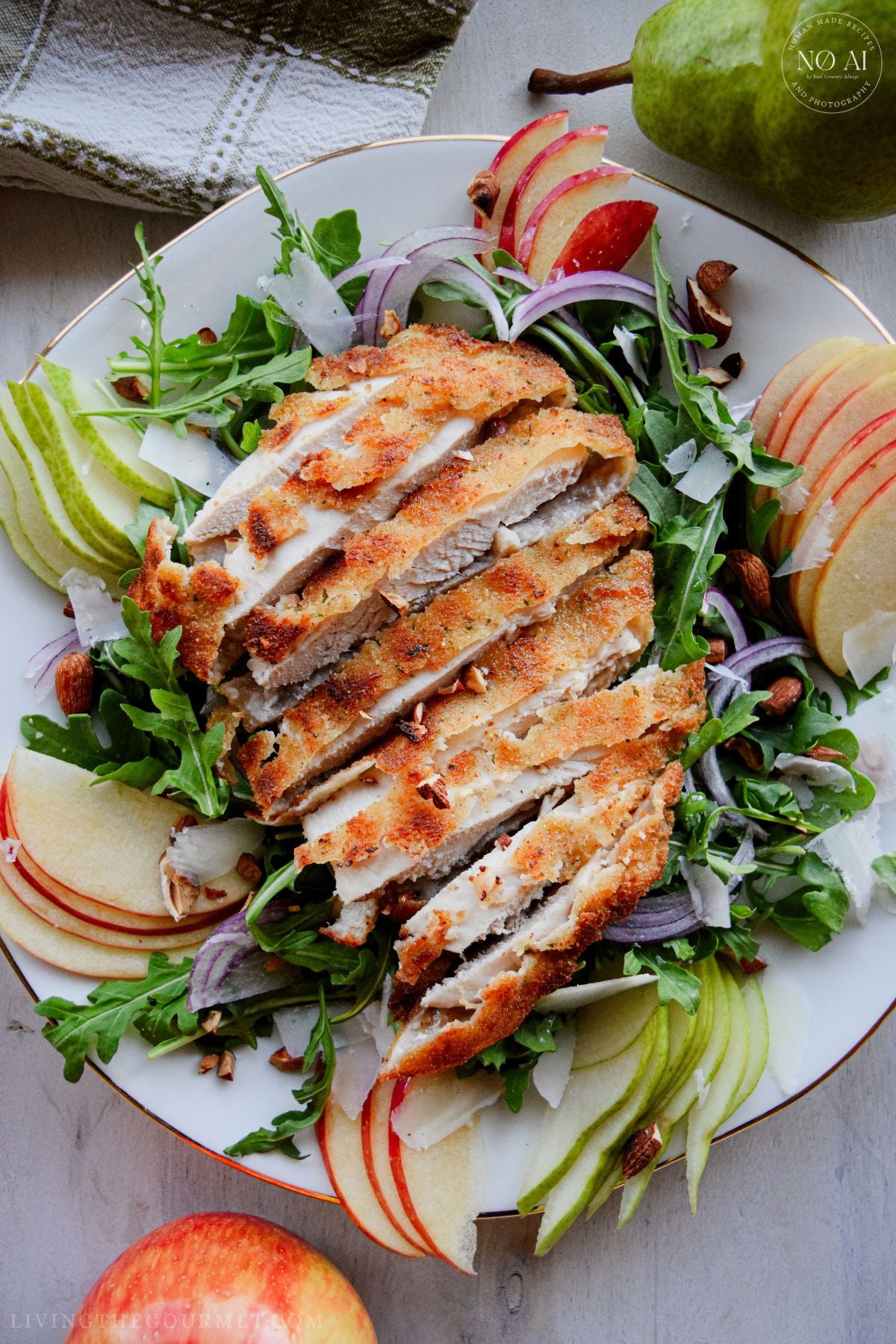 Golden pan-fried breaded chicken cutlets sliced over a fresh bed of arugula, sliced pears, apples, red onions, and toasted almonds