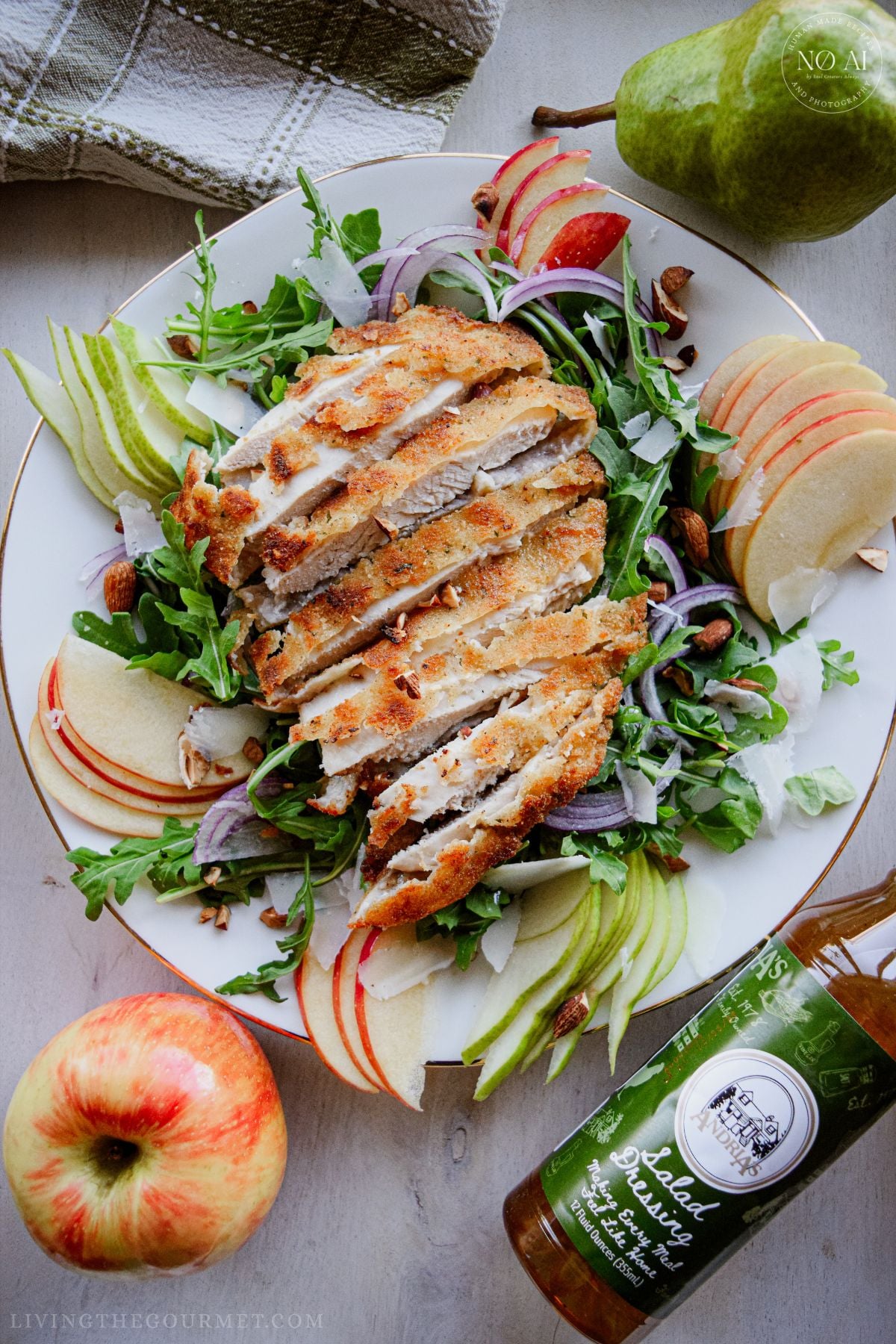 Golden pan-fried breaded chicken cutlets sliced over a fresh bed of arugula, sliced pears, apples, red onions, and toasted almonds