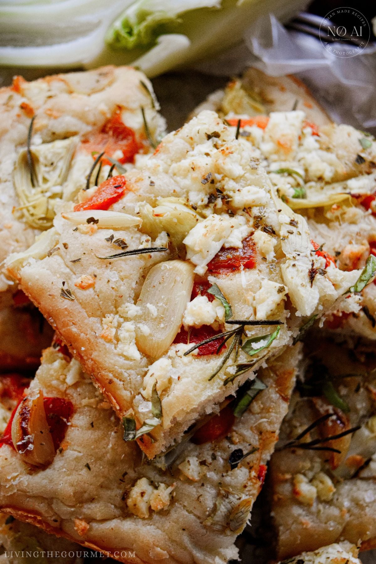 Homemade Roasted Garlic and Artichoke Focaccia with olive oil and feta cheese